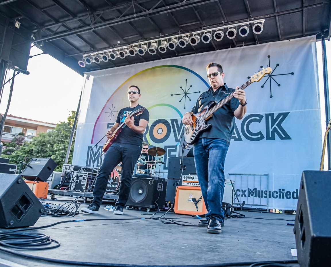 Live band performing on the Throwback Music Fest main stage during the day